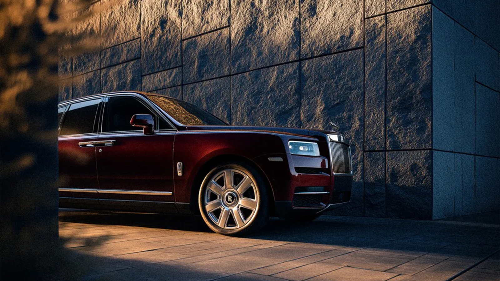 A Rolls-Royce presented within a sculptural contemporary setting