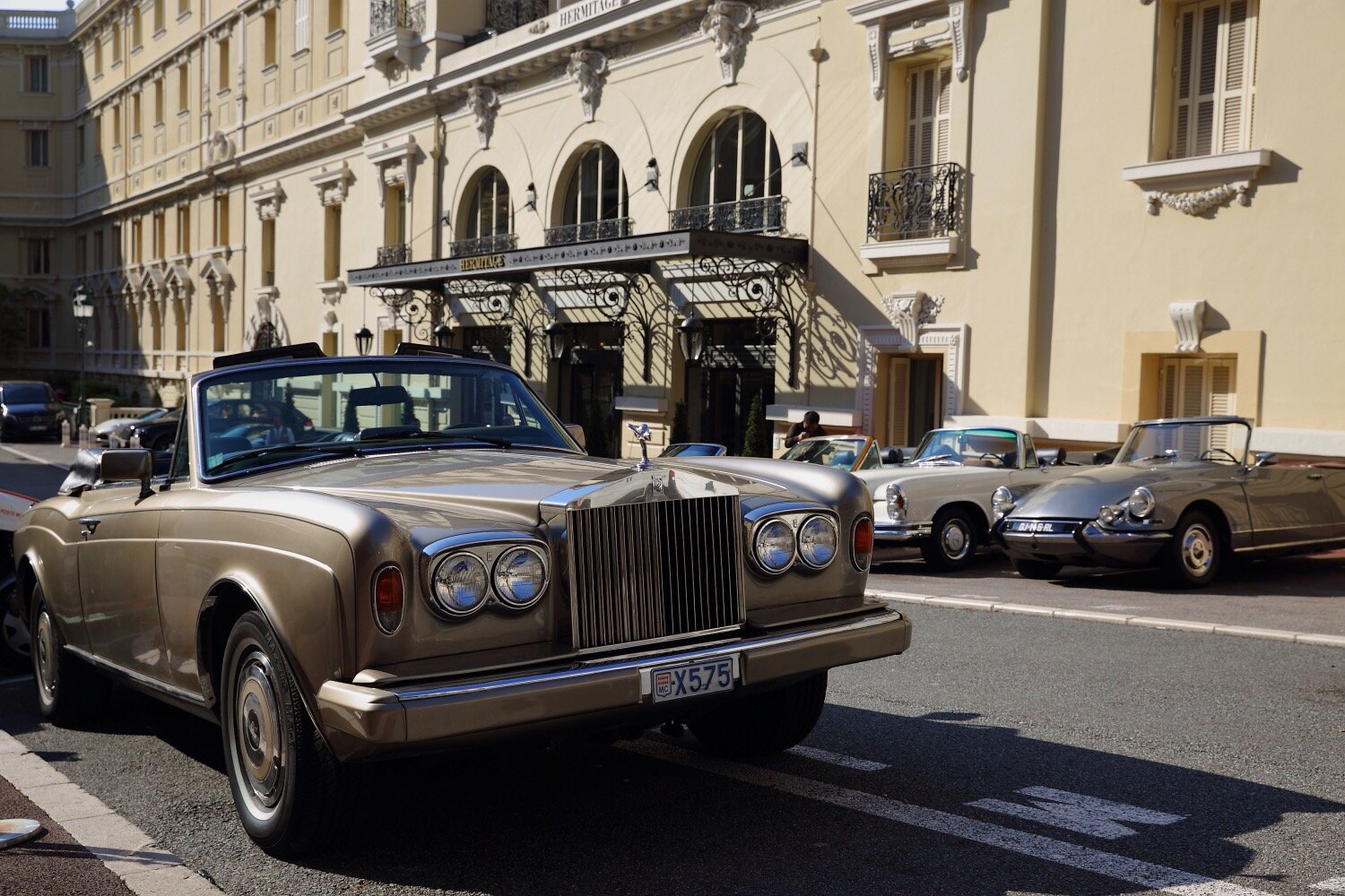 Classic cars outside a historic hotel